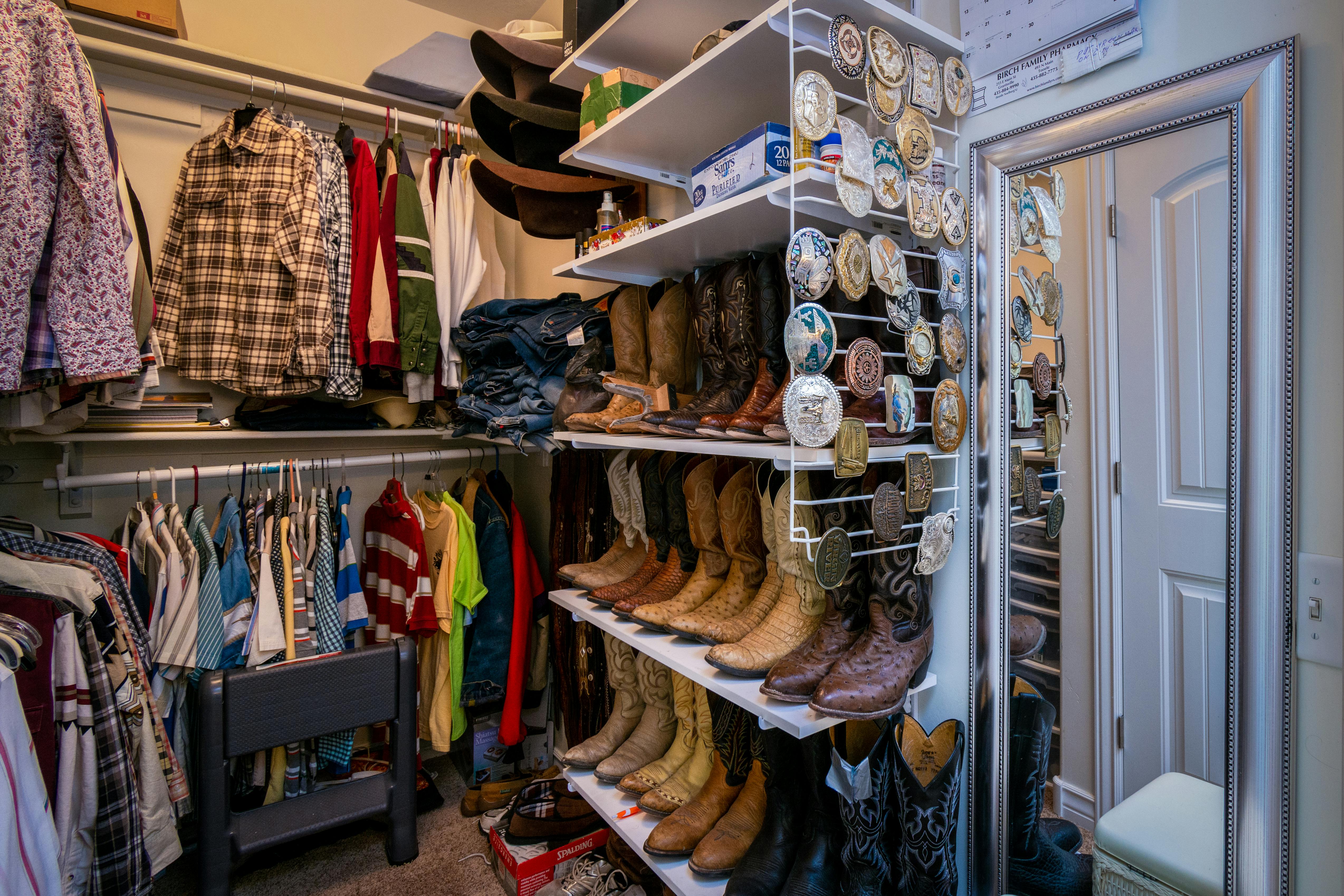 A neatly organised closet of pre-loved fashion items ready to be sold